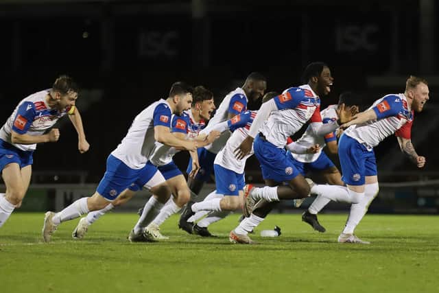 The ecstatic AFC Rushden & Diamonds' players celebrate after the winning penalty hit the net (Picture: Peter Short)