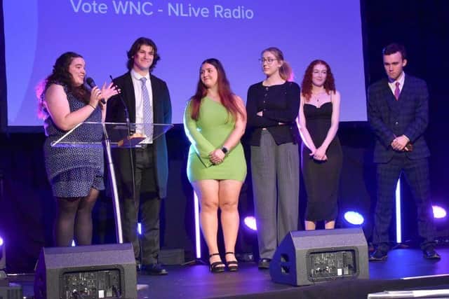 The team of students step on the stage to collect their award.