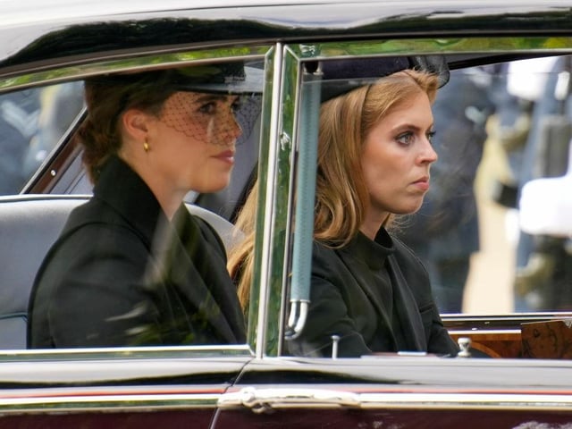 Princesses Eugenie and Beatrice are seen in a car following the State Funeral of Queen Elizabeth II at Westminster Abbey