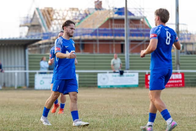 Reuben Marshall is congratulated after opening the scoring against Rothwell Corinthians (Picture: Jim Darrah)