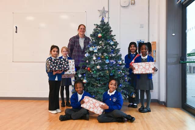 Pupils with the Stanton Cross Primary School Christmas tree