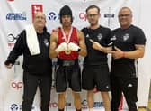 Leighton Forbes celebrates his success with the Wellingborough ABC backroom team