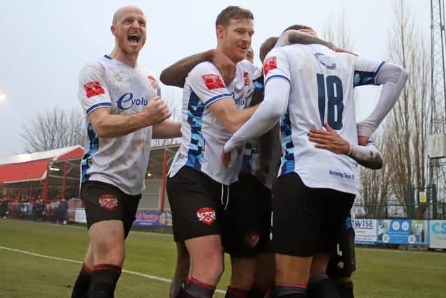 The Poppies players celebrate after Jonny Edwatrds' penalty (Picture: Peter Short)
