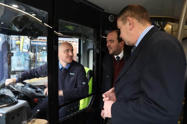 Driver Graham Tranter with  Buses minister Richard Holden MP,  and MP for Kettering Philip Hollobone