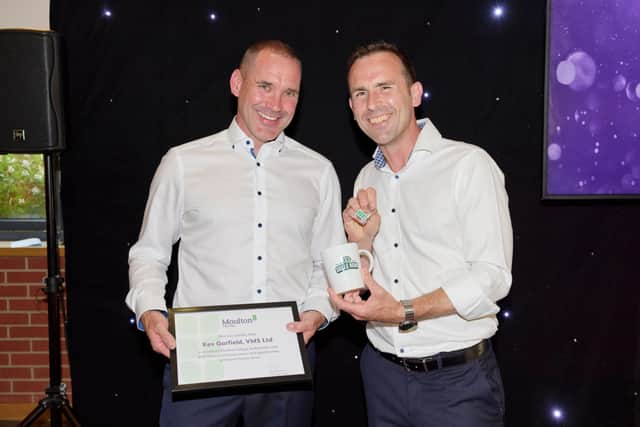 Pictured is Kev Garfield (left) accepting his Ambassador award from Oliver Symons, Principal & CEO at Moulton College
