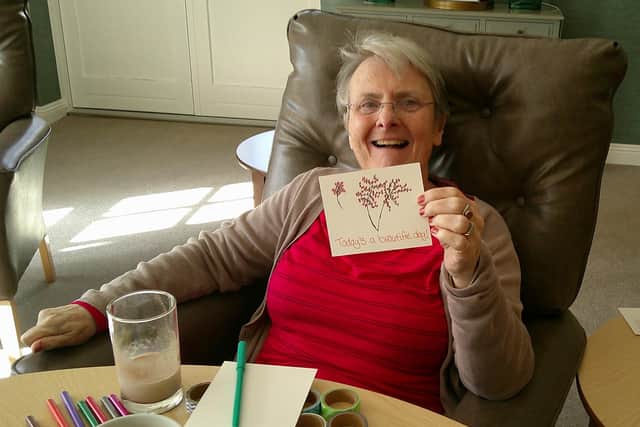 Residents making positivity cards for World Mental Health Day