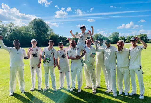 Freddie McGeown's S&L team-mates give him a lift following his incredible bowling figures