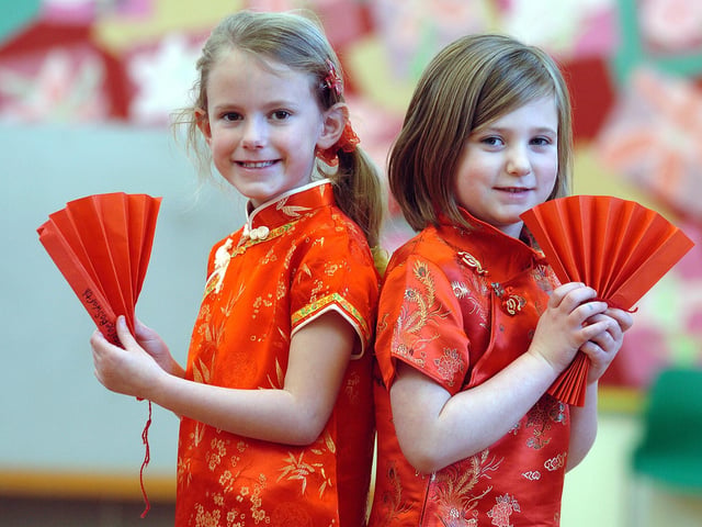 Desborough, Havelock Infants School Chinese New Year celebrations  l-r Isabel Panter, 6, and Izzie Hill, 5,  February 2010