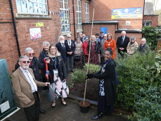 Morcea Walker plants a tree to mark the 150th anniversary with on left former headteachers John Kidney and Harry Curtis, and current headteacher Kelly O'Connor