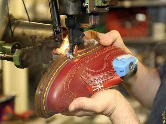 A pair of Dr Martens boots being made in Wollaston