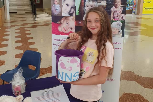 Shaniya fundraising in the Swansgate shopping centre for Niamh's Next Step