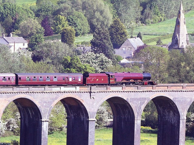 The village of Harringworth forms the backdrop as steam locomotive Princess Elizabeth pulls the Cathedrals Explorer train over Harringworth viaduct on Friday, May 25, 2012. The locomotive built in 1933 was pulling the train on its last lef of an eight day tour of Scotland and passed through  Corby, Kettering and Wellingborough on its way back to LondonBy Glyn Dobbs