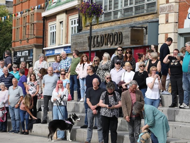 People stood to sing the national anthem