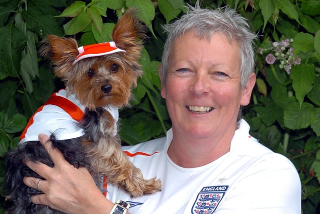 Corby, Yorkshire Terrier dressed in England kit. Bobby the dog with owner Gail Laird.  June 2006