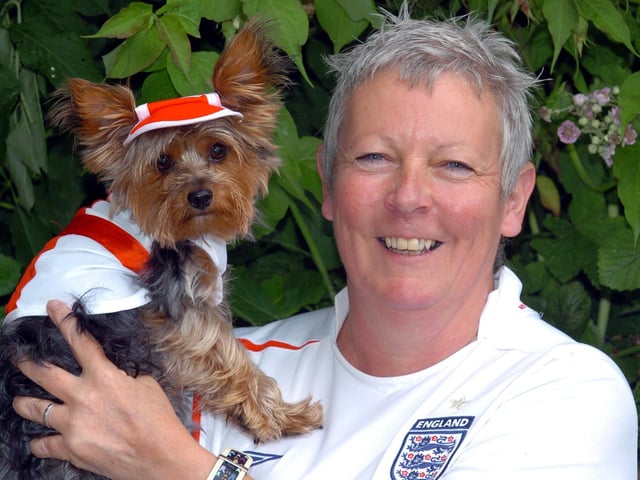 Corby, Yorkshire Terrier dressed in England kit. Bobby the dog with owner Gail Laird. June 2006