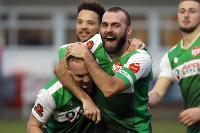 Captain Gary Stohrer celebrates with goalscorer Ethan Hill during Kettering Town's 3-0 victory at Banbury United last weekend. Pictures by Peter Short