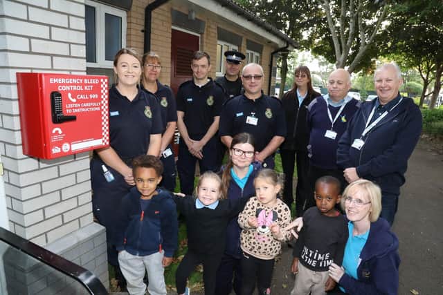 North Northants Community First Responders, neighbourhood officer for Northants Police Vince Bangs,  Crescents Community Centre manager Mandy Raffill, Cllr Paul Marks and Cllr Robin Cater (North Northants Council) and children and staff from next door Ronald Tree Nursery