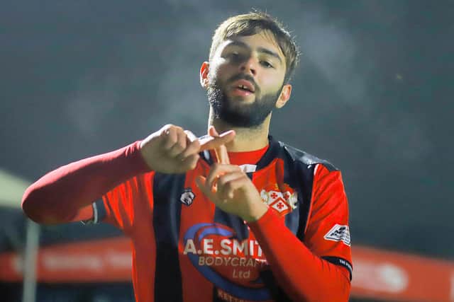 Theo Alexandrou celebrates after making it 4-0 (Picture: Peter Short)