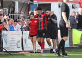 Blaine Rowe is helped off the pitch during the FA Cup defeat to Worcester City (Picture: Peter Short)