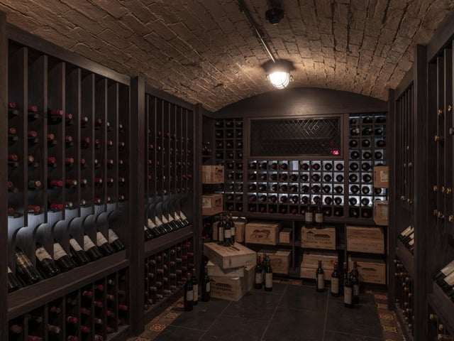 It comes with a well-stocked wine cellar