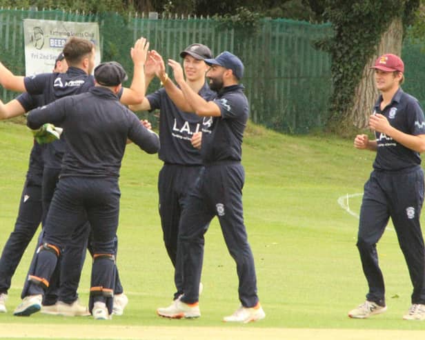 Kettering celebrate a wicket during their defeat to Northampton Saints in the top-of-the-table clash in Division Two. Pictures by Finbarr Carroll