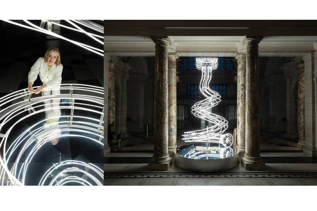 Artist Anna Lomax with her Christmas sculpture All Lit Up! at the V&A Museum in London /V&A
