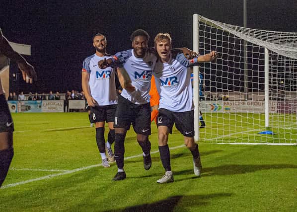 Hilton Arthur and Scott Floyd celebrate after the latter set up the former for his second goal of the game in Corby Town's 4-1 win over Yaxley on Wednesday night. Picture by Jim Darrah