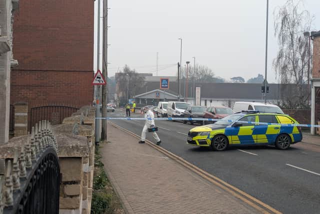 People in white coverall suits were frequently entering the premises in Newcomen Road