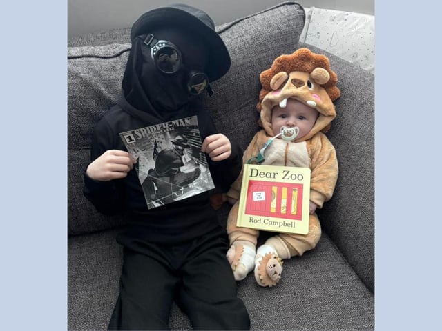 Clark age 7 as Spider-Man Noir, and Henry, 3 months, as the lion from Dear Zoo