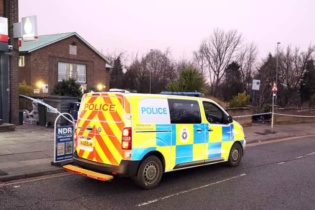 Police on the scene of the stabbing in Elizabeth Street in Corby