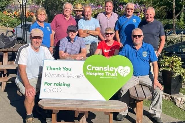 Members of Waendel Walkers Club presenting Cransley Hospice Trust with £500