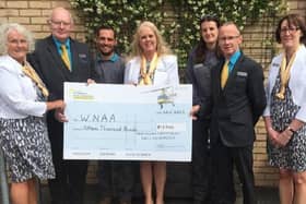 Staff presented a cheque for £15,000 to Warwickshire and Northamptonshire Air Ambulance