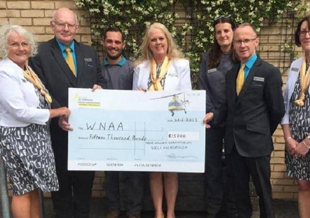 Staff presented a cheque for £15,000 to Warwickshire and Northamptonshire Air Ambulance