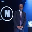 Host Clive Myrie with Mastermind trophy