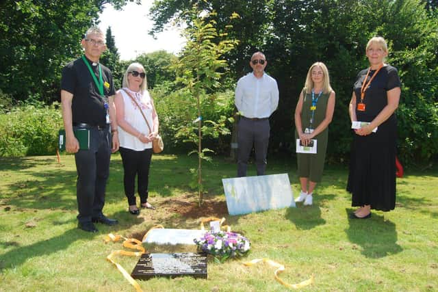A service was held at KGH to bury memorial crosses to those lost during the pandemic.