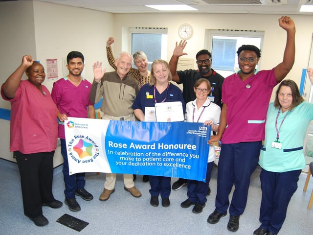 Jude Armstrong with her colleagues celebrating her award.