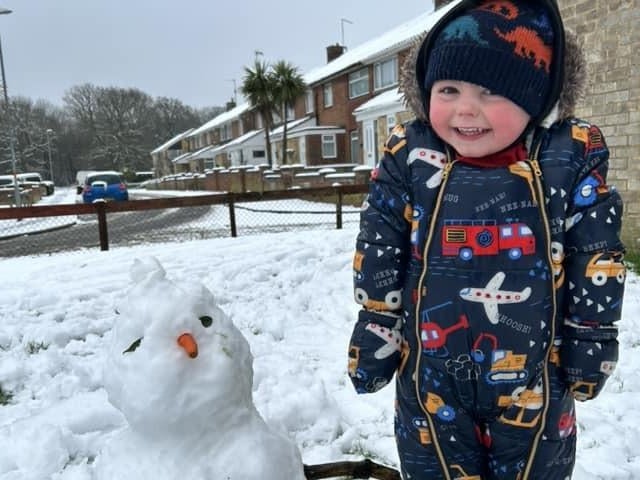 Mia Beattie sent in this image of Jackson and his 'snow baby'