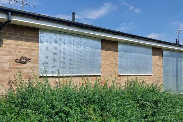 The bungalow in Higham Ferrers which has been boarded up. Image: Northants Police