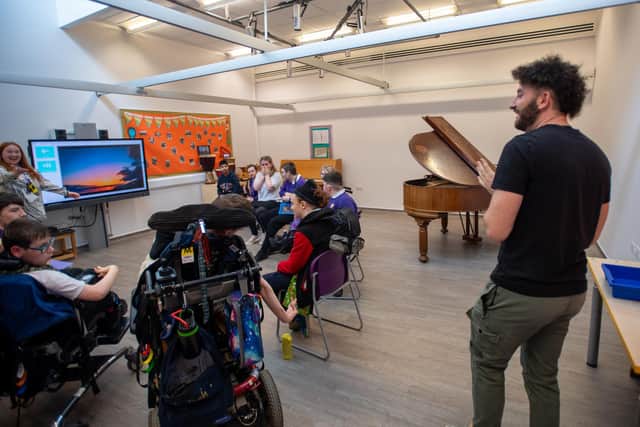 Billy Lockett visiting Greenfields Specialist School For Communication to donate the piano he wrote his debut album on. Photo by David Jackson.