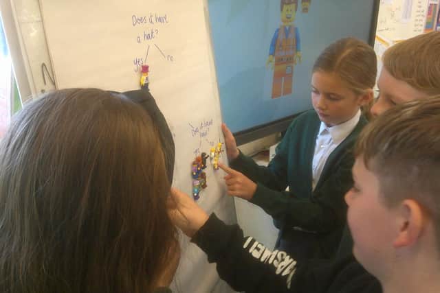 Children at Earls Barton School hard at work in science, classifying and sorting Lego characters.