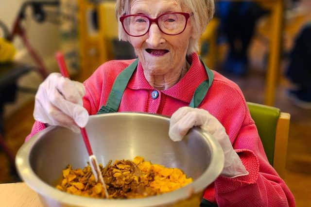 Elm Bank Care Home resident enjoying the Easter Cake creations