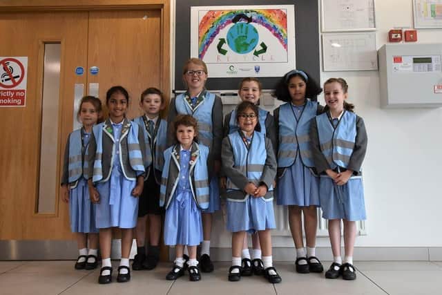 Children in front of winning recycling poster