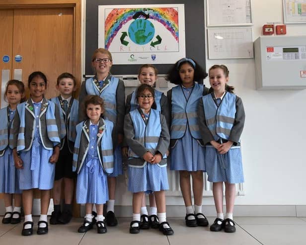 Children in front of winning recycling poster