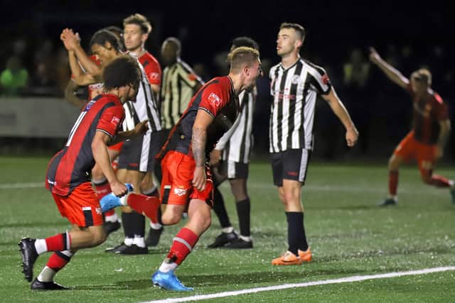 Lewis White races away to celebrate after scoring Kettering Town's late winner at St Ives (Picture: Peter Short)