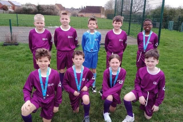 The team proudly posing in their new kit