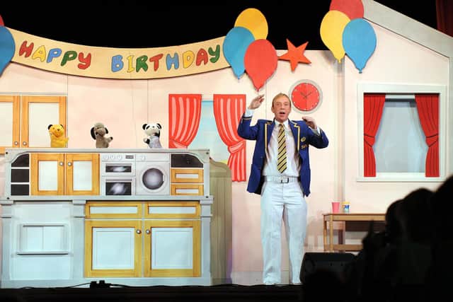 Sooty, Sweep and Soo with Richard Cadell in a previous show (photo: Asadour Guzelian)