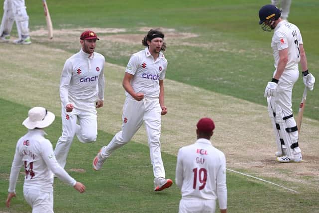 Jack White celebrates claiming the wicket of Lancashire's Luke Wells at the County Ground