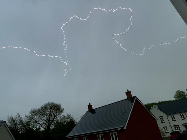 This perfectly-timed shot shows lightning overhead