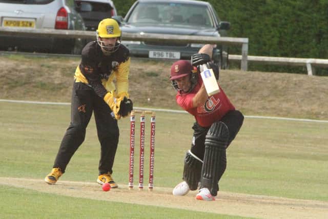 Greg Smith plays a shot during his century for Kislingbury Temperance against Peterborough (Picture: Finbarr Carroll)