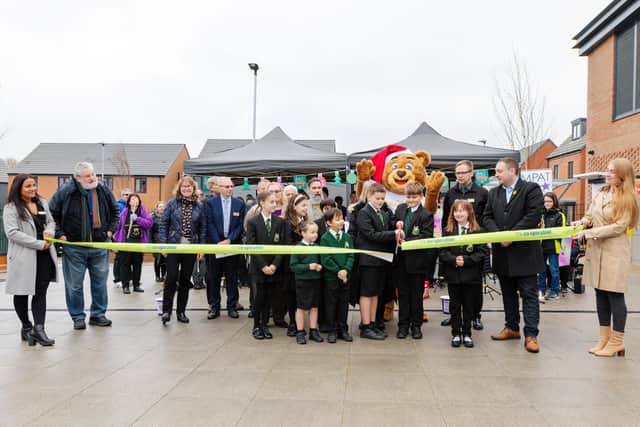 Steve Browne, chief executive of the Heart of England Co-operative Society (second from right) watches on as pupils from Glenvale Church of England Primary School cut the ribbon to officially open the new food store.
